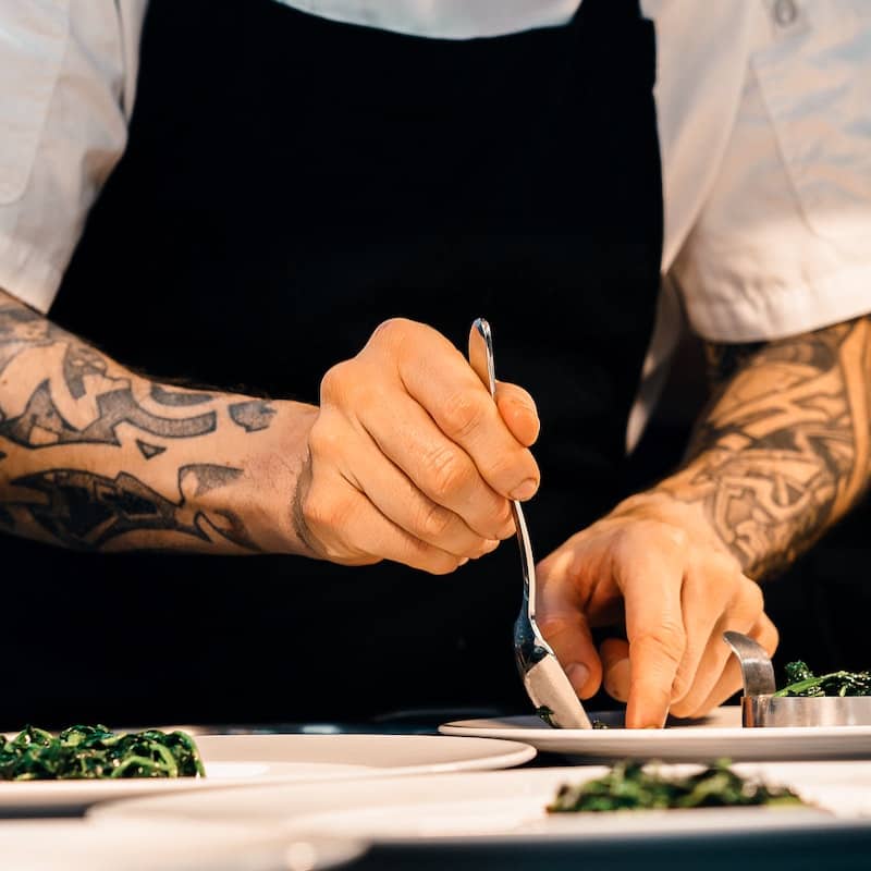 Photo of chef using forks cooking